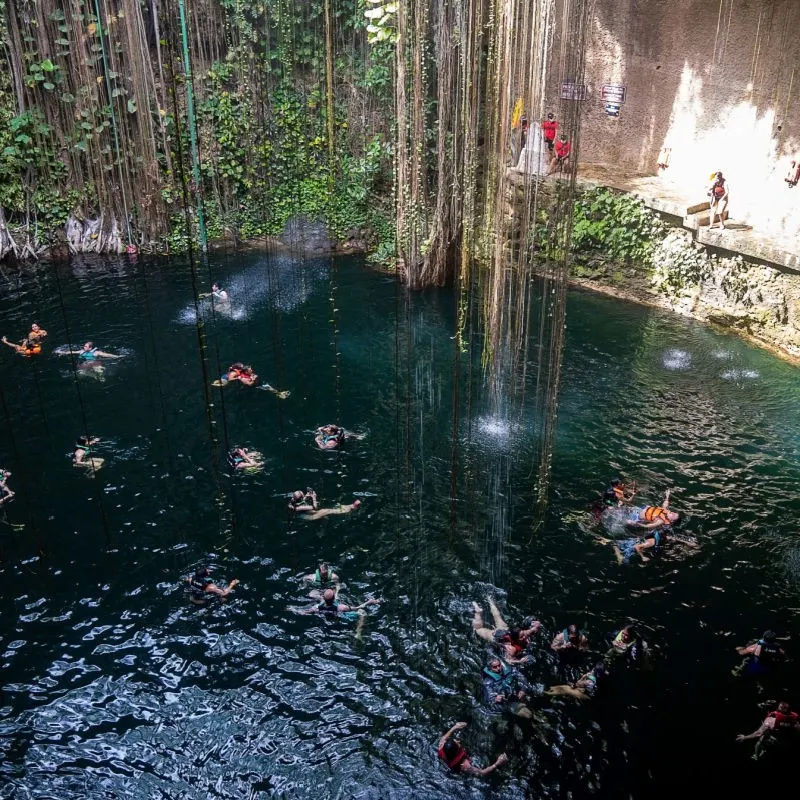 People Swimming in a Cenote Near Cancun, Mexico