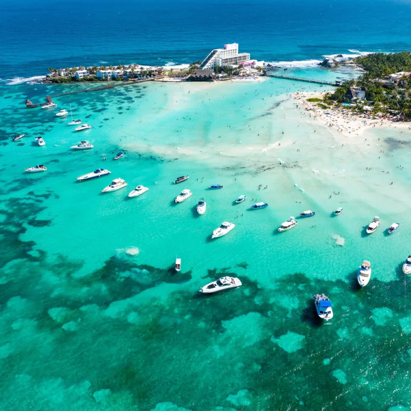 playa norte with boats docked in the shore 