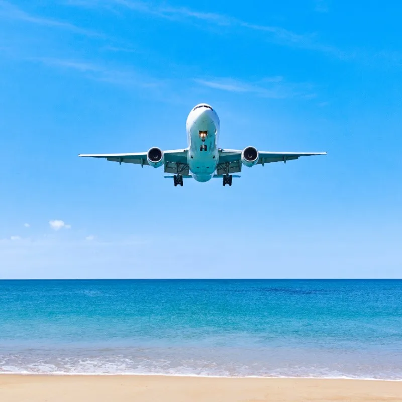 Plane Flying Over Water Right Before Landing