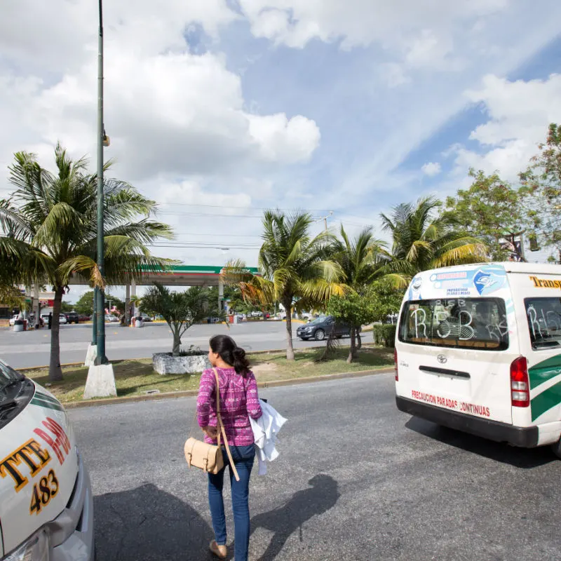 A passenger waiting to board a taxi in Cancun