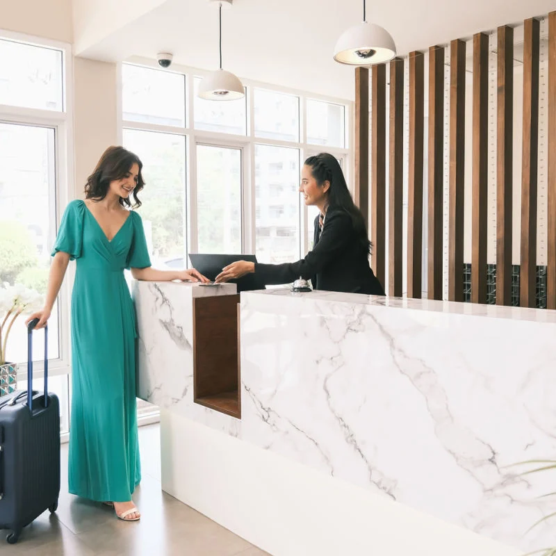 A guest being checked in at a luxury hotel