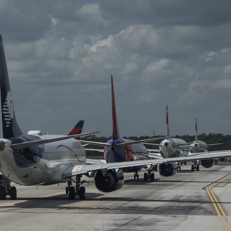 airplanes on tarmac in cancun
