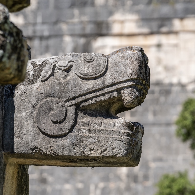 chichen itza serpent head statue