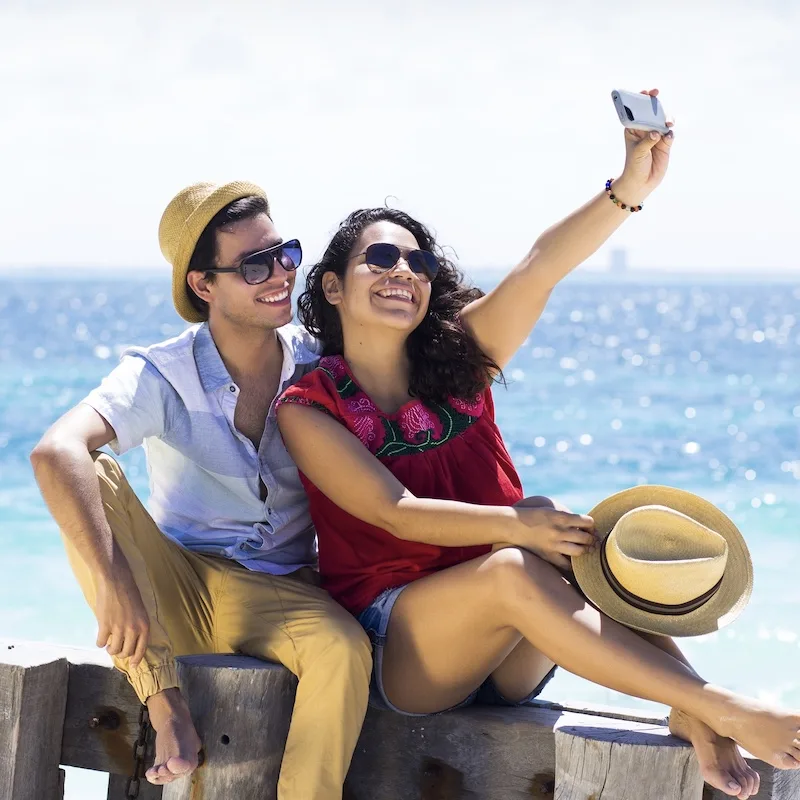 couple taking selfie on beach