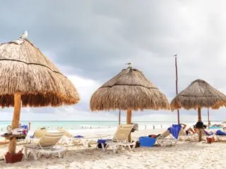 tiki umbrella shade at cancun beach on sunny day