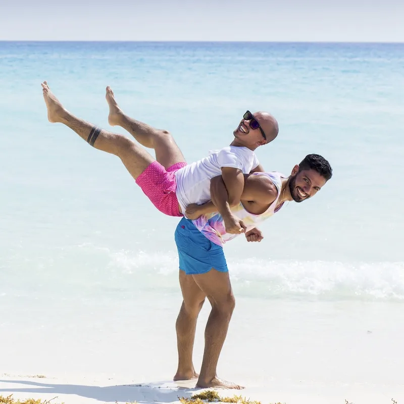 happy lgbtq couple beach