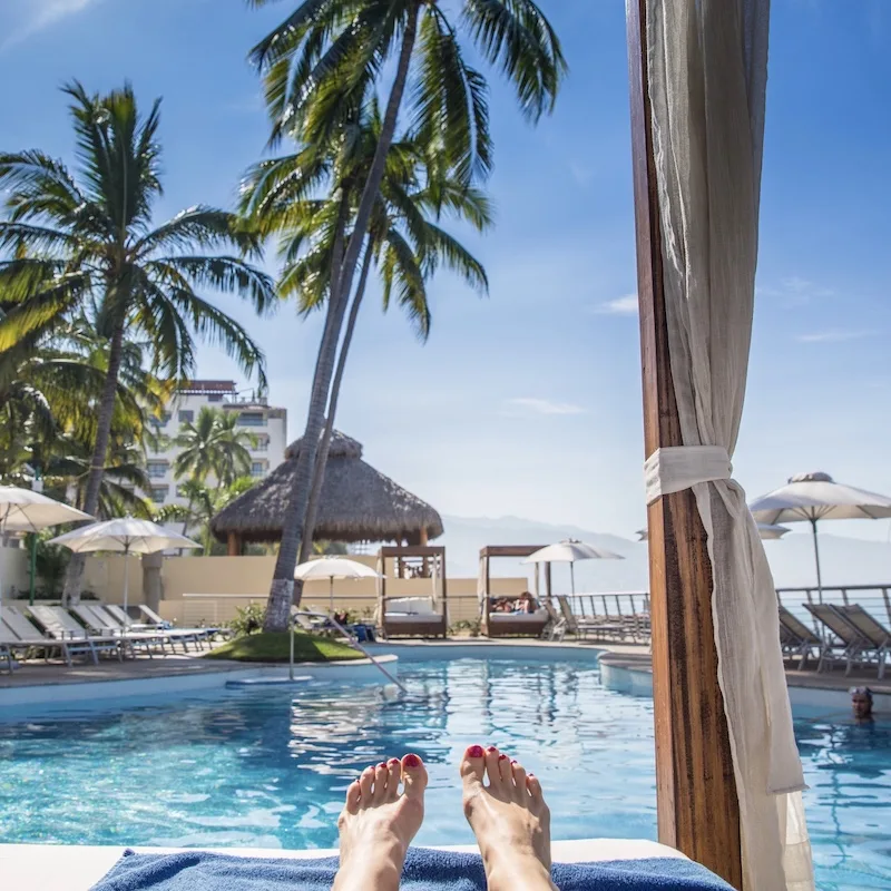 traveler lounging pool cancun