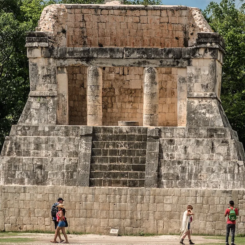 travelers tour a chichen itza temple