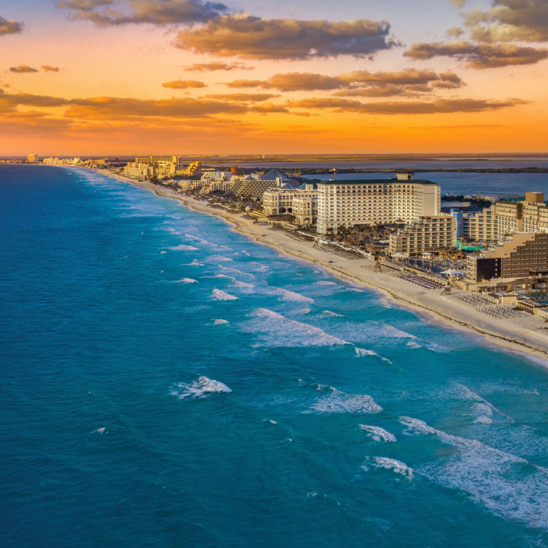 Beautiful sunset in Cancun with resorts and beaches