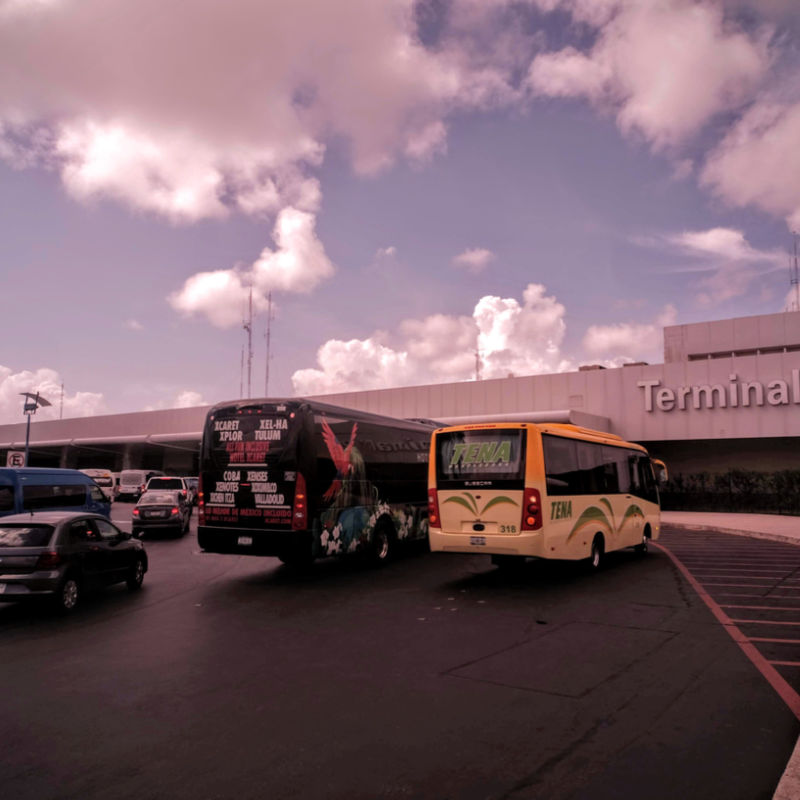 Busses and taxis waiting outside Cancun International Airport