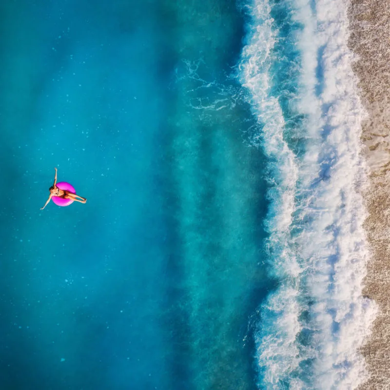 A woman floating on the sea in Costa Mujeres 