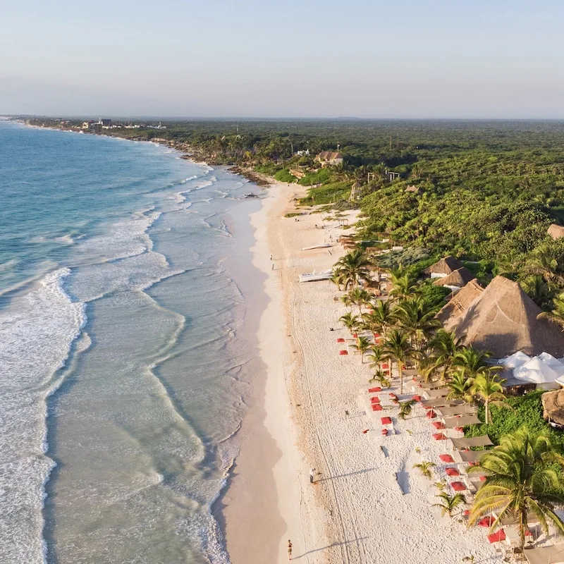 aerial drone view of Riviera Maya beach in the late afternoon.