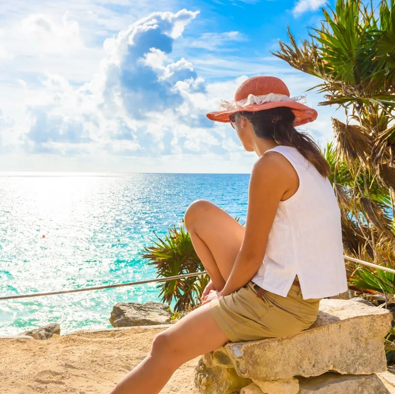 Tourist looking out over the Caribbean sea