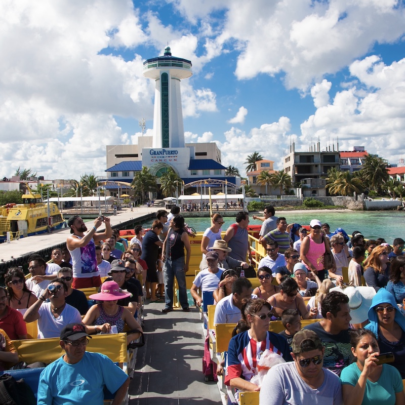 a busy ferry departing to cozumel