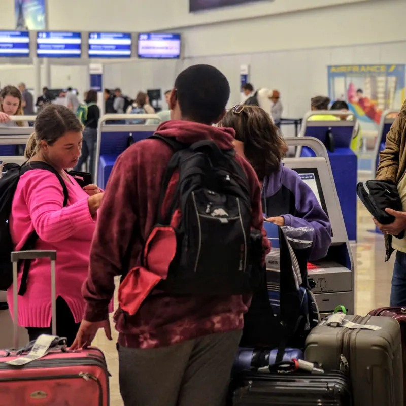 Passengers inside Cancun airport waiting for flight 