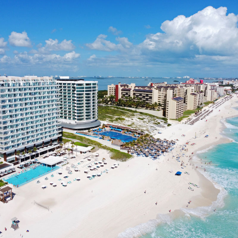 Aerial view of Cancun's resort zone with travelers on beach