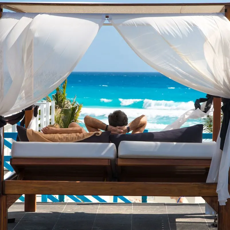 man in front of pool cancun