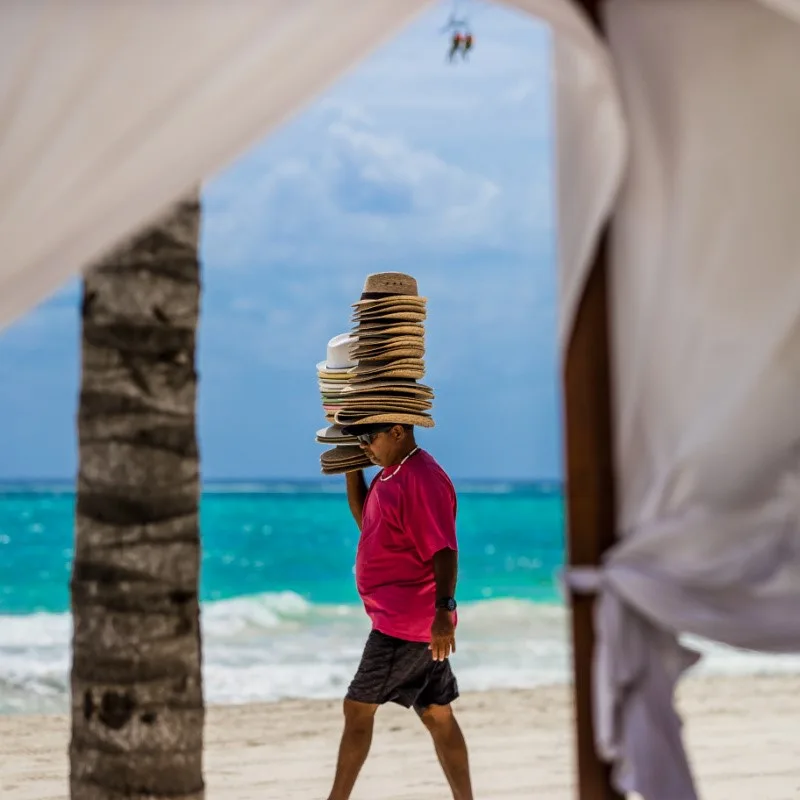 Hat Vendor on a Playa del Carmen Beach