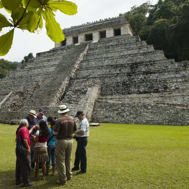 Tourists at chichen itza wearing long clothing