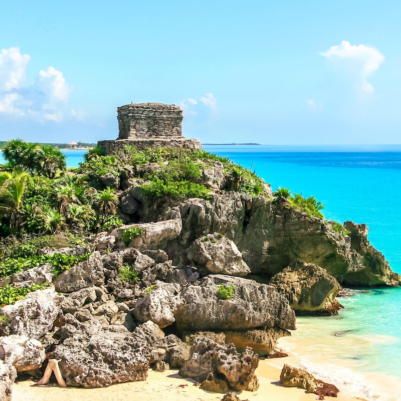 Panoramic view of the mayan ruins of Tulum, Mexico. God of Winds Temple in a sunny day. Mayan ruins of Tulum, Quintana Roo, Mexico.
