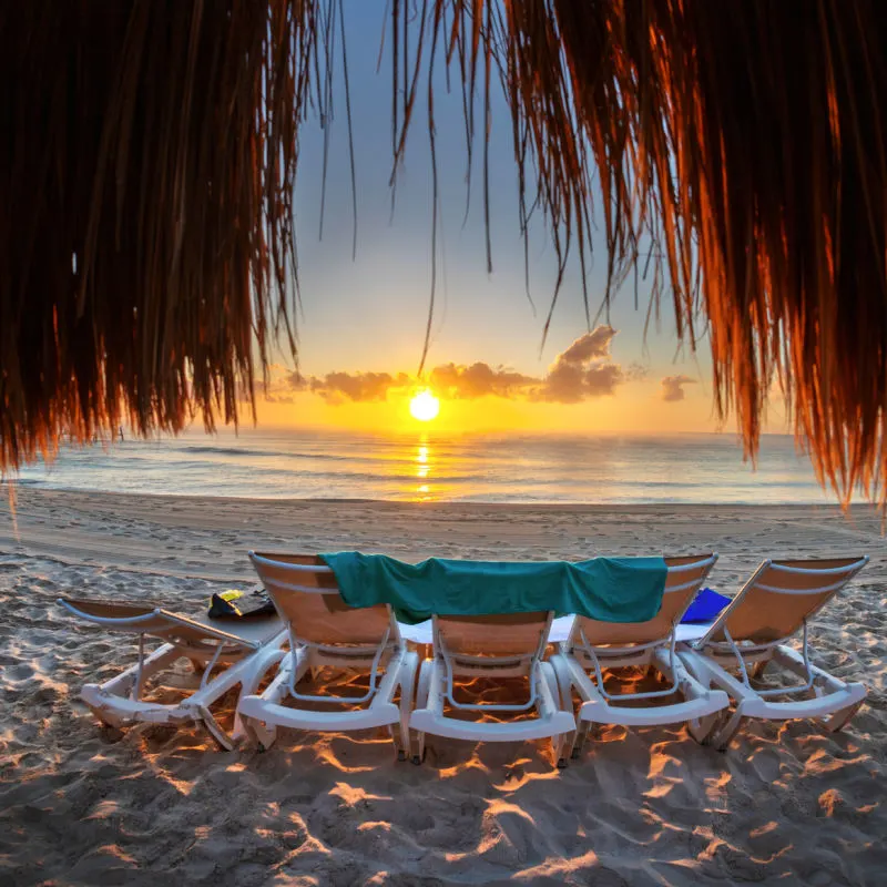 beach chairs at sunset