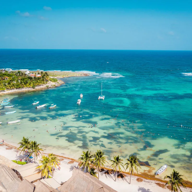 Aerial view of a beach in Akumal with blue water