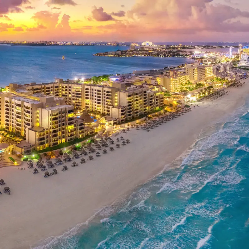 Evening view of the Cancun resort zone with large buildings 