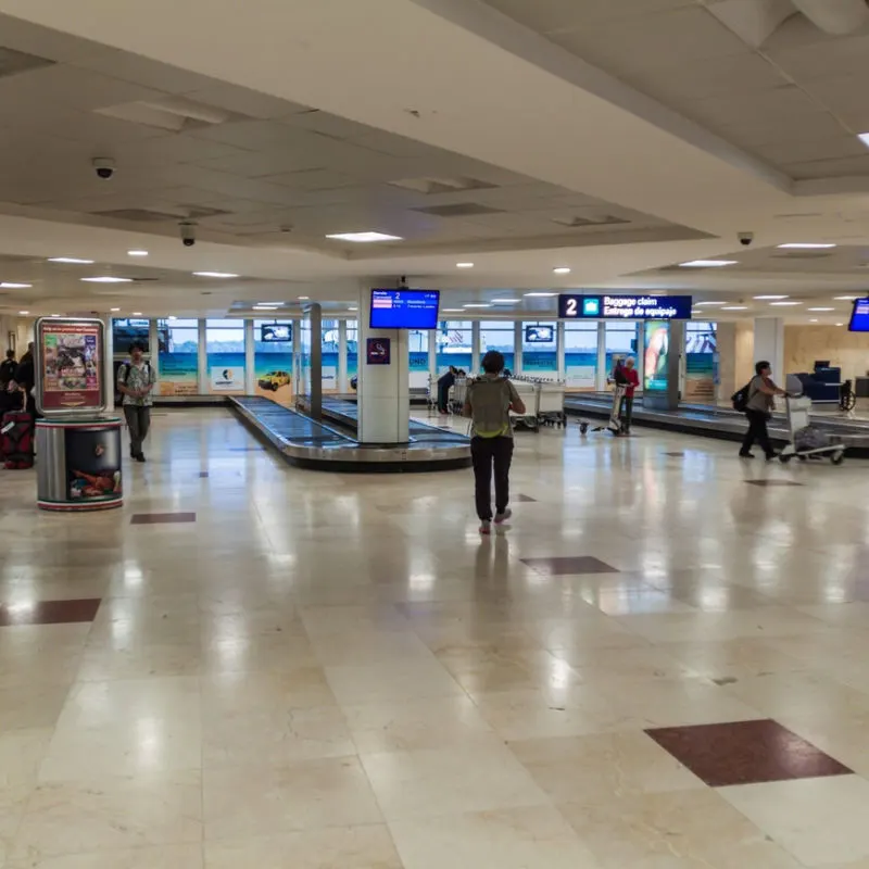 Inside view of Cancun's airport with luggage 