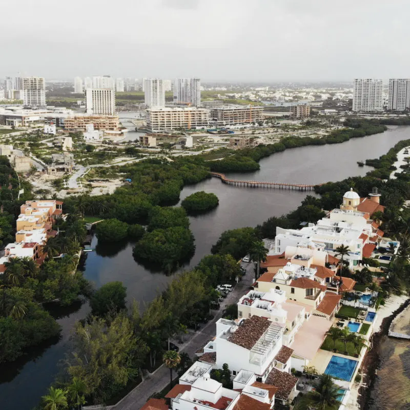 Cancun's downtown area with a river and highrises 