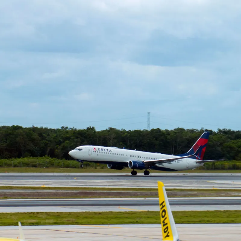 Delta aircraft taking off in Cancun International Airport 