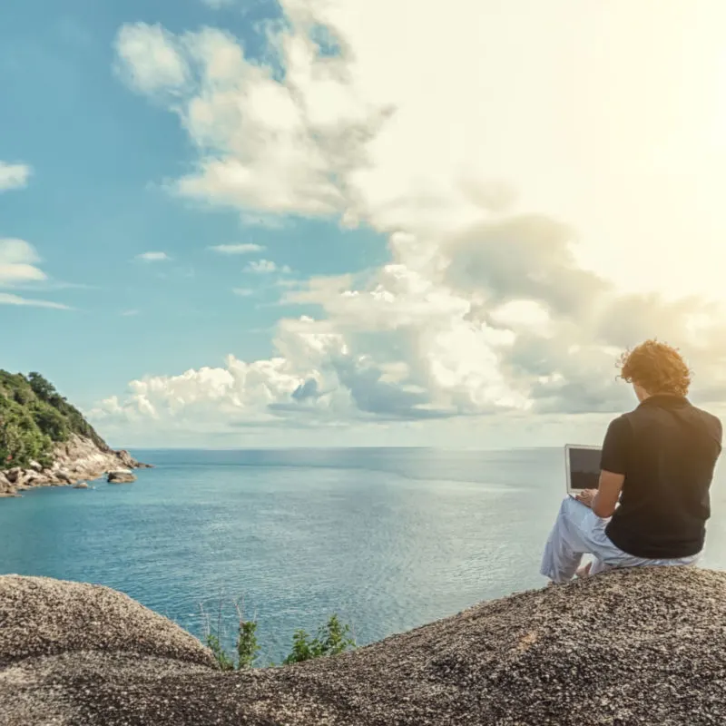 A digital nomad working by the sea in the Mexican Caribbean