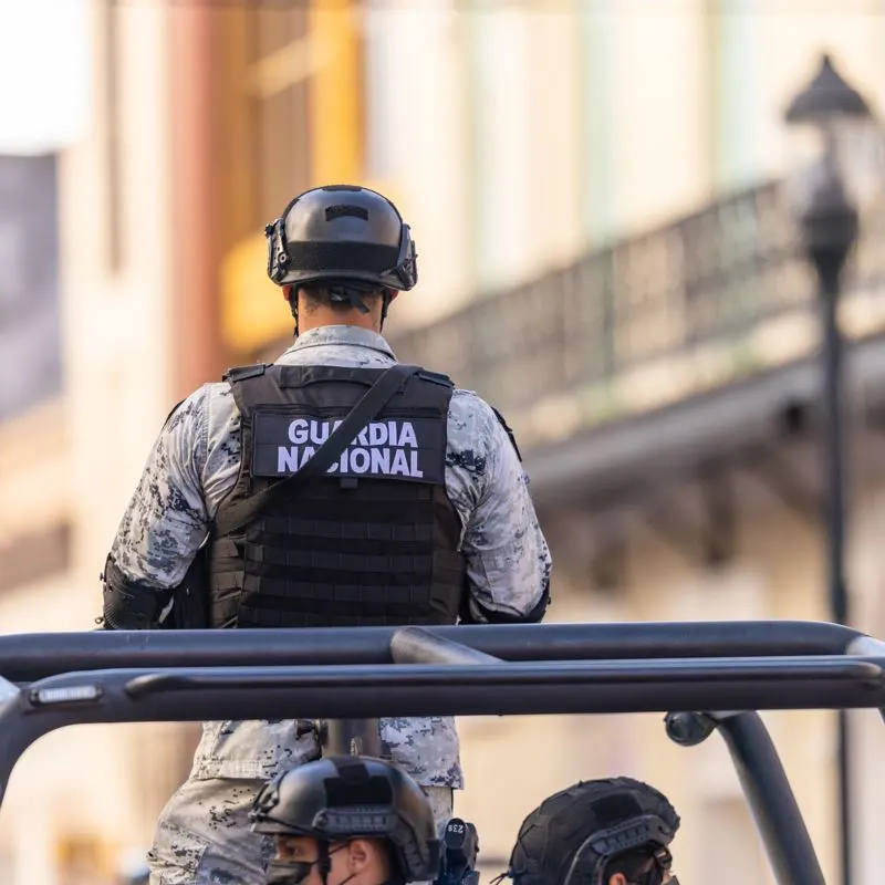 Mexican national guard officer in a pick up truck