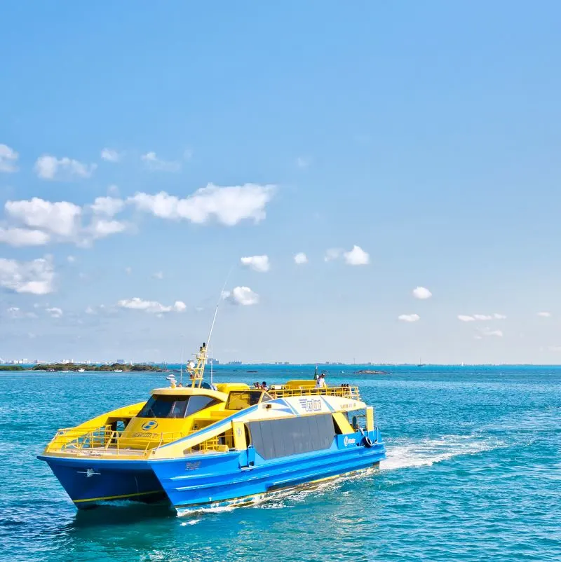 Isla mujeres yellow and blue ferry