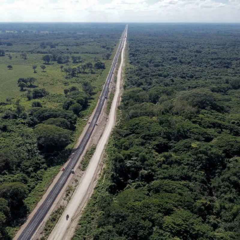 Massive railway track belonging to the Maya Train as it traverses the forest 