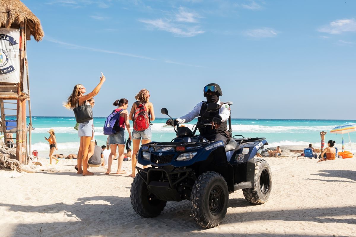 Military and Police Patrolling Cancun Beaches