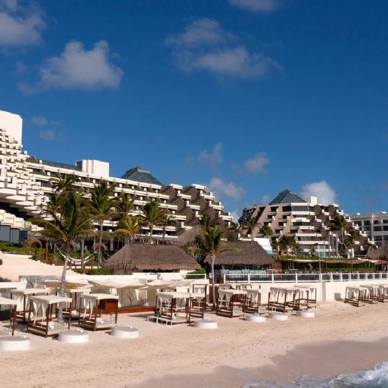 Paradisus in Cancun with a beach and chairs 