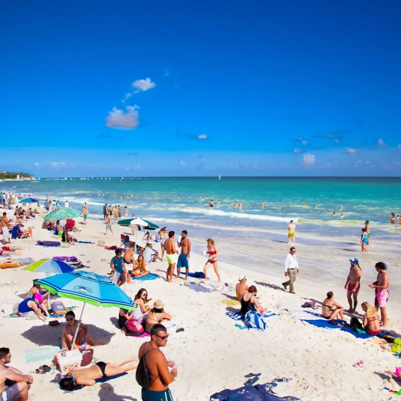 Beachgoers in Playa del Carmen in packed location