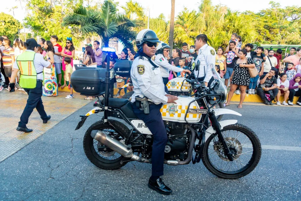 Police Officer on a Street in Cancun, Mexico Controlling a Crowd
