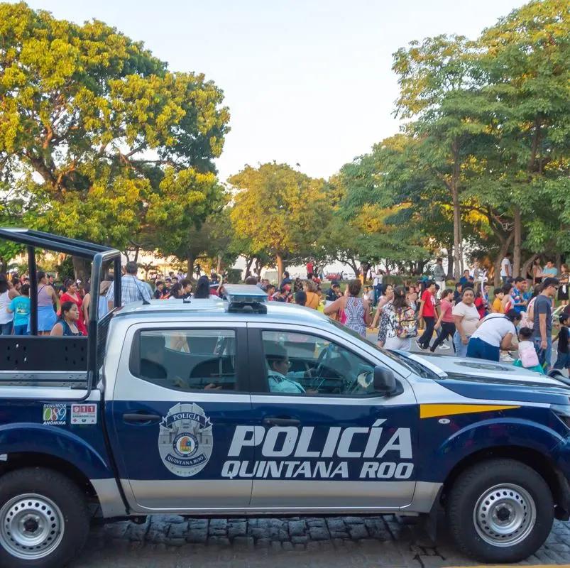 Quintana Roo Police Truck in Front of a Crowd