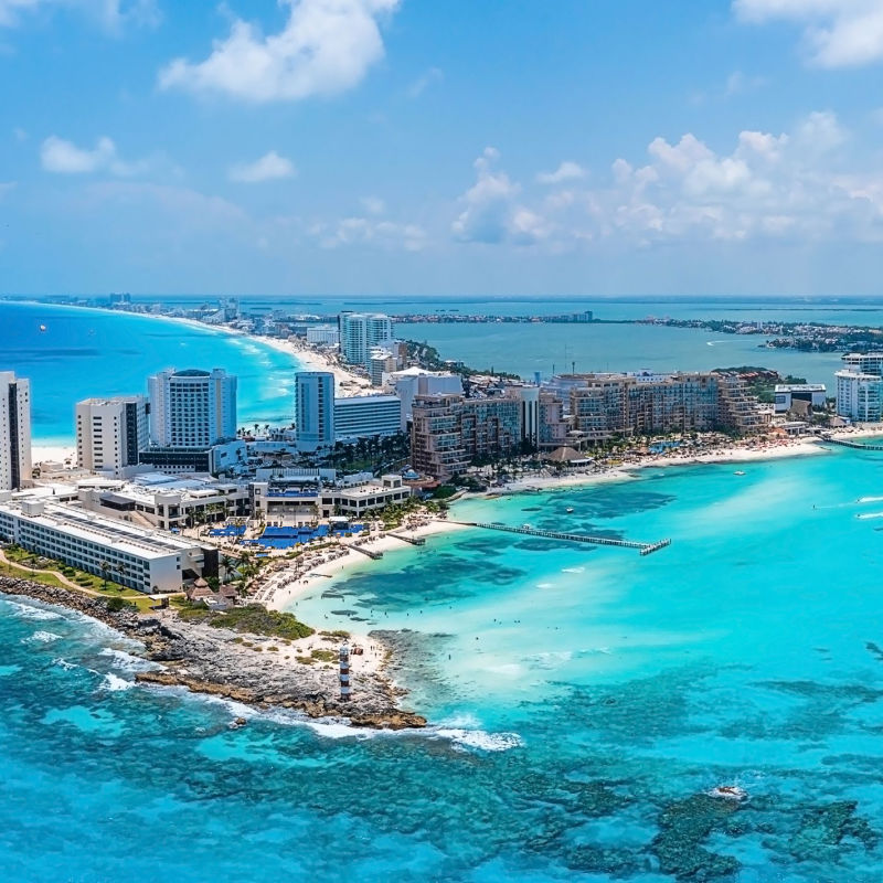 Aerial view of a Cancun resort zone with blue water