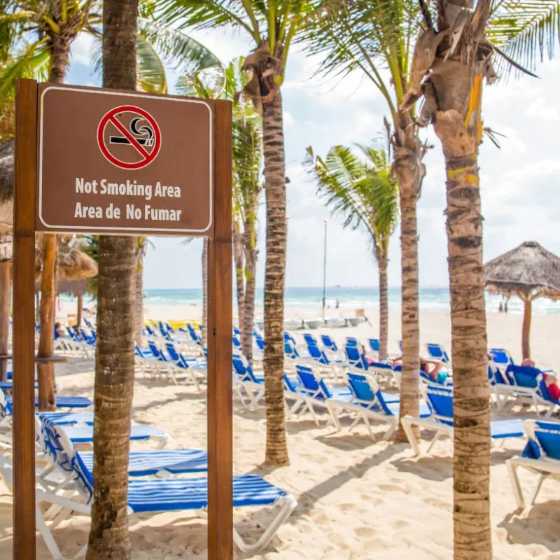 No Smoking Sign on the Beach in English and Spanish