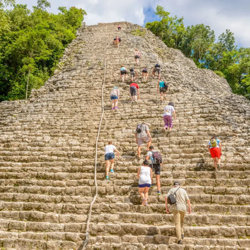 people walking on ruins