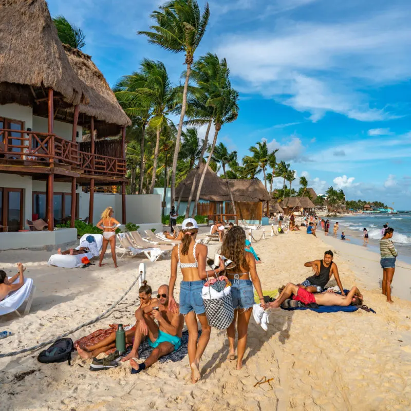 Travelers on a popular beach in Cancun