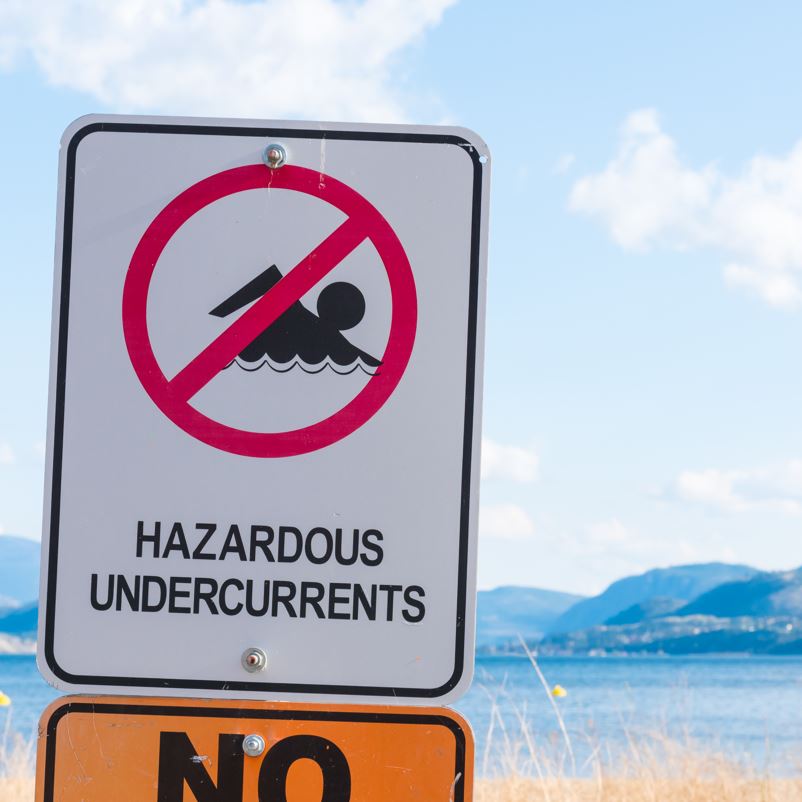Hazardous undercurrents sign by a beach