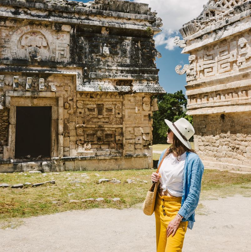 Woman in chichen itza looking at ruins