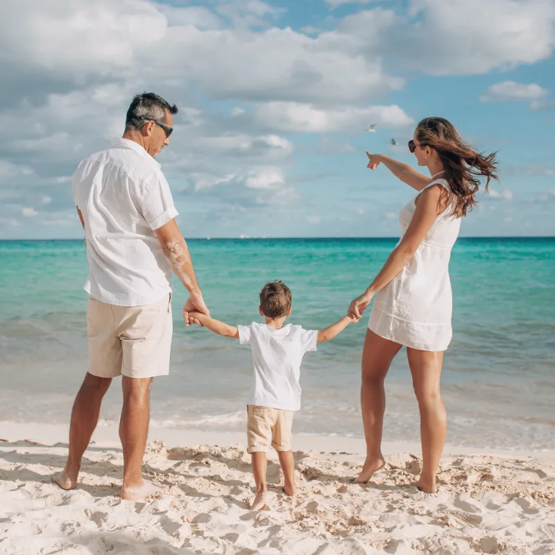 family on the beach in cancun