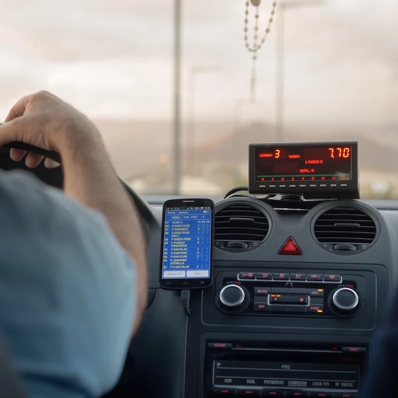 taxi meter rosary beads drivers forearm