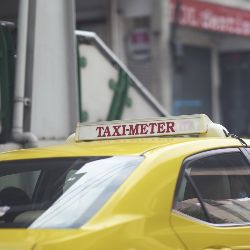taxi with taxi meter sign