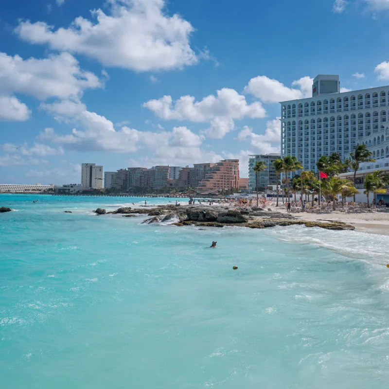 Beach, water, and large resorts in Cancun 