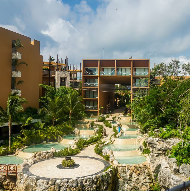 Hotel Xcaret grounds with water feature